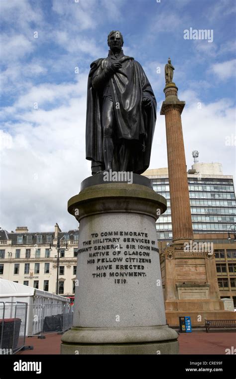 lieutenant general sir john moore statue in george square with sir walter scott column in the ...