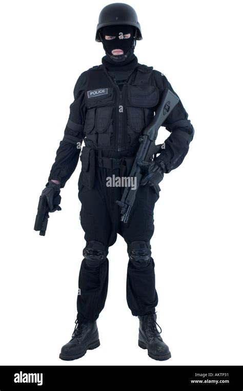 a swat police officer in full uniform with helmet and mp5 machine gun ...