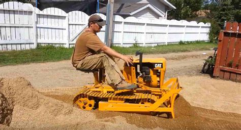 VIDEO: Don't let this adorable mini 'Cat' dozer fool you. It's got ...