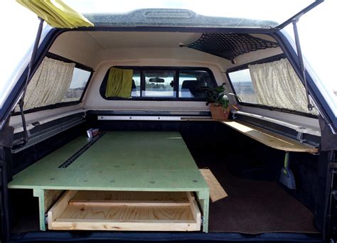 tiny truck camper | mini home in truck bed | truck canopy camper ideas | sleeping platform ...