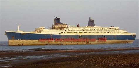 This is a famous ship named ss norway was at the beach and started to ...