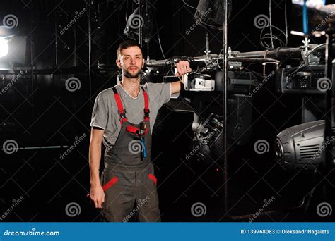 The Lighting Engineer Adjusts the Lights on the Stage. Stock Image - Image of male, audio: 139768083