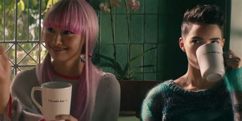 In Deadpool 2, Yukio and Negasonic's cup says "I'm with her" with arrows pointing towards each ...