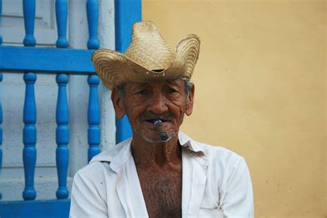 Man Wearing Straw Hat While Smoking · Free Stock Photo