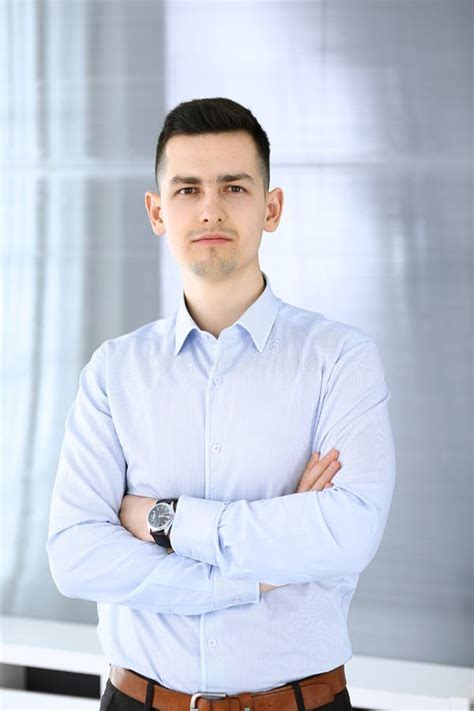 Businessman Standing and Looking at Camera in Office. Headshot of ...