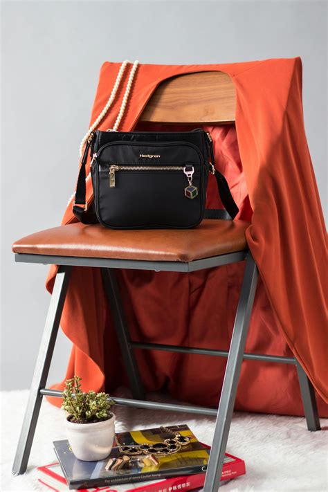 Black Crossbody Bag On Chair · Free Stock Photo