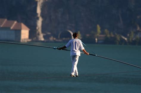 Why Do Tightrope Walkers Carry A Pole/Bar During Their Performance? » ScienceABC