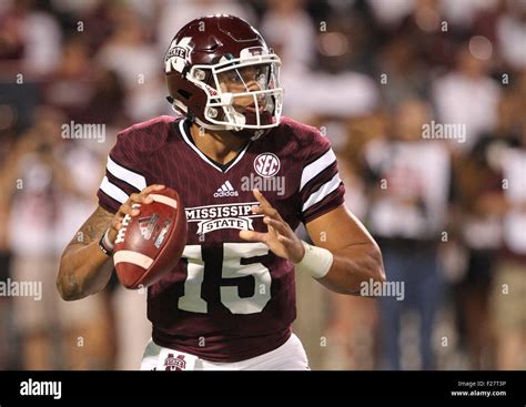 Mississippi State QB, Dak Prescott (15) looks for an open receiver ...