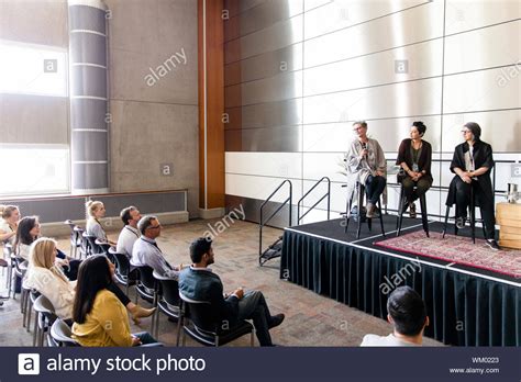 Female inspirational speakers answering audience questions Stock Photo - Alamy