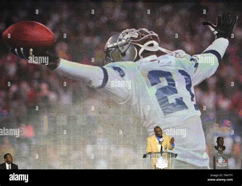 Deion Sanders delivers his induction speech during the Pro Football ...