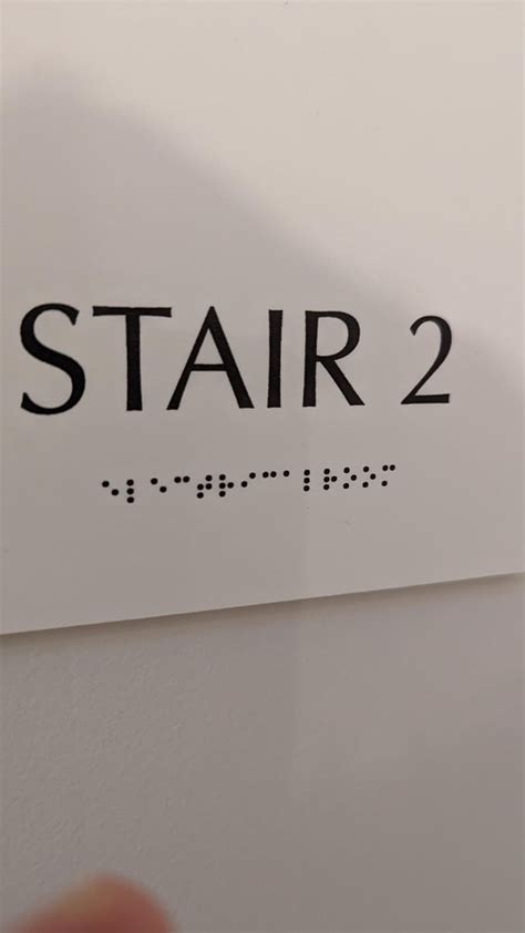 The braille on this sign is printed. The dots aren't raised. : r/mildlyinteresting