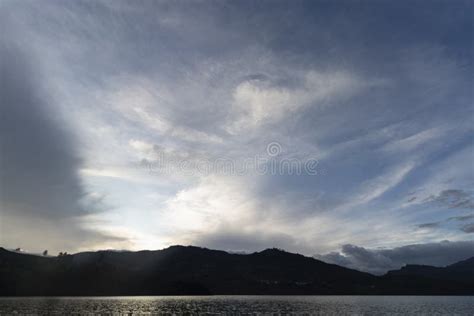 Beautiful Sunset Skyscape with Mountain Range Silhouette and Lake Stock ...