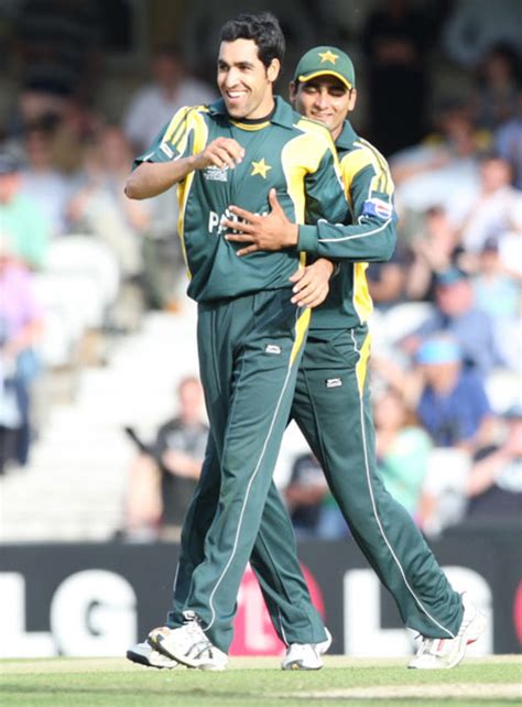 Umar Gul gets a hug from Shahzaib Hasan after getting Peter McGlashan's ...