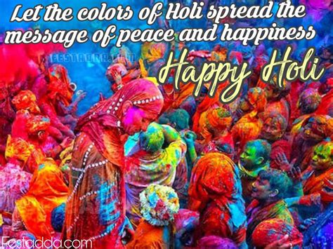 people covered in colored powder and celebrating holi day with the message happy holi