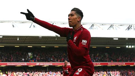 Roberto Firmino does a frisky celebration after his scoring his second goal of the game in ...