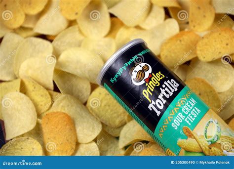 Pringles Sour Cream Fiesta Flavour. Cardboard Tube Can On Many Pringles Potato Chips Background ...