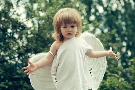 Premium Photo | Small boy in angel wings