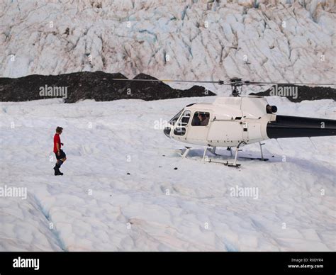 Helicopter landing on Franz josef glacier in New Zealand Stock Photo - Alamy