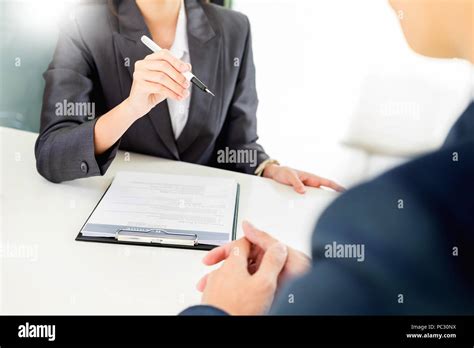 Female Manager conducting a job interview with female applicant looking ...