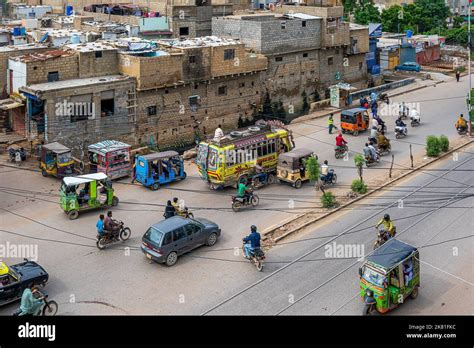 An aerial view of little buses and bikes on Korangi Roads in Karachi ...