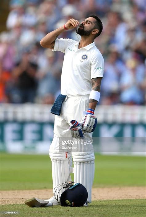 India batsman Virat Kohli celebrates his century by kissing his ...