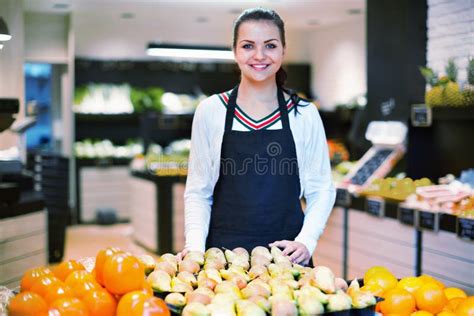 Shopping Assistant Demonstrating Assortment of Grocery Shop Stock Photo ...