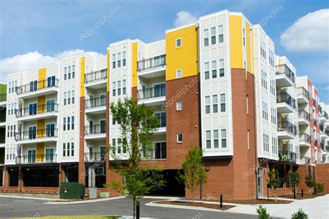 Modern apartment building with parking garage — Stock Photo © kzlobastov #27058329