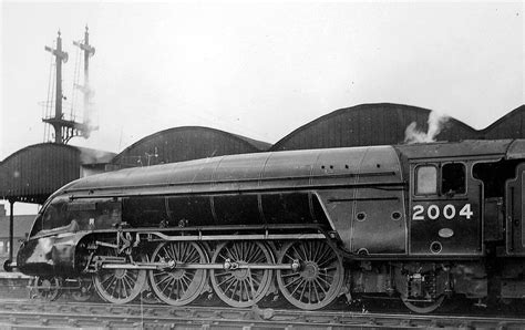 an old black and white photo of a train