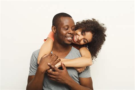 Black couple hugging and posing at white background – International Institute of Sleep