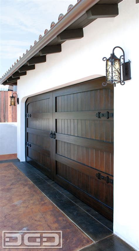 Spanish Garage Doors Made in Solid Wood With Decorative Iron Hardware | Dynamic Garage Door Projects