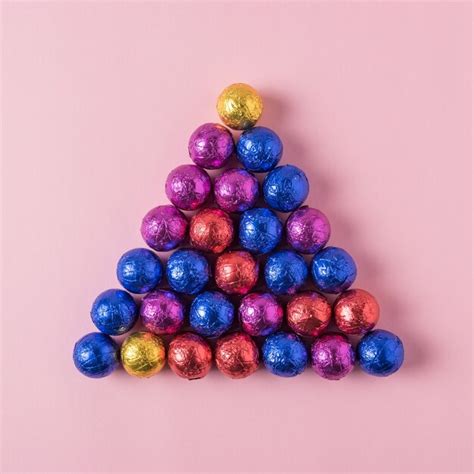 Premium Photo | Creative colored candy isolated on pink