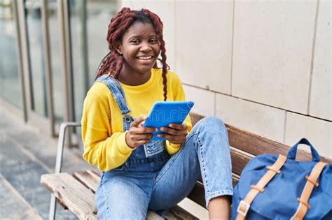 African American Woman Student Using Touchpad Sitting on Bench at University Stock Image - Image ...