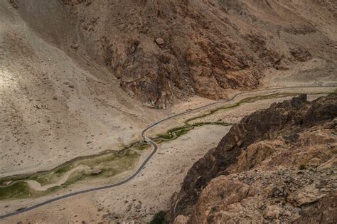 Aerial view of Pangong lake road crossing a valley, Ladakh, India ...