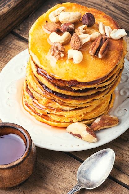 Premium Photo | Pancakes stack with nuts