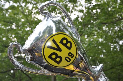 Inflatable Champions League Trophy with Borussia Dortmund Logo raised in the Air - Creative ...
