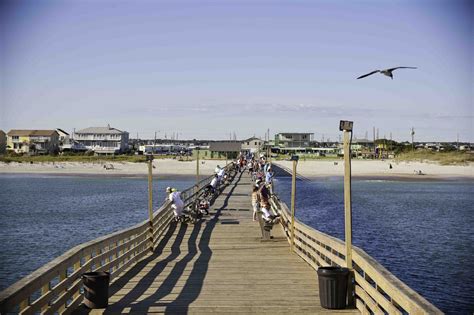 Writer's inspiration: Mama tosses back a bluefish she catches on a pier ...