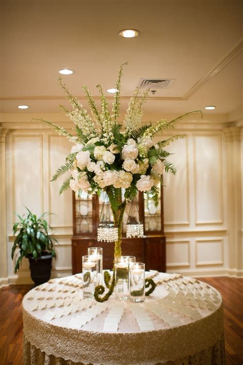 Tall Flower Arrangement With Ivory Roses and Delphiniums | Tall flower arrangements, Wedding ...