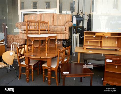 Used second hand furniture on sale on a UK high street Stock Photo - Alamy