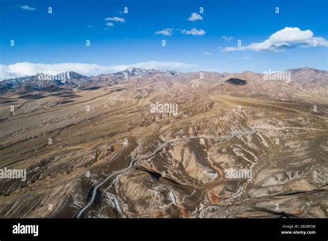 aerial view of the curved Qilian mountain road Stock Photo - Alamy