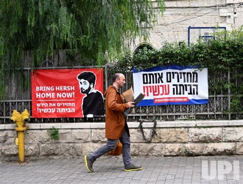 Photo: People Pass Posters of Israeli Hostages Held By Hamas In Gaza ...