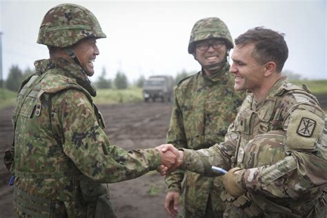 Battalion Commanders shake hands after successful planning and ...