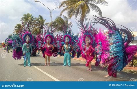 Carnival in Aruba, People in Colorful Costumes Walk in the Parade ...