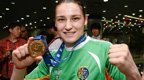 Katie Taylor displays her gold medal in China