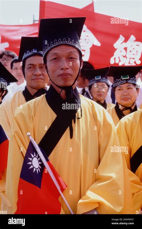 Taiwan. Taipei. National Day parade. Men in yellow robes. Confucian ...