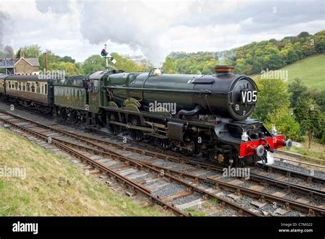 GWR King Class 4-6-0 No 6024 King Edward I steam locomotive leaves Highley Station, Shropshire ...