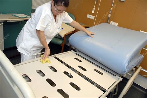 Nurse cleaning hospital bed - Stock Image - C001/3105 - Science Photo ...