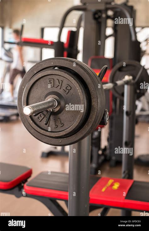 weight training equipment at the gym room Stock Photo - Alamy