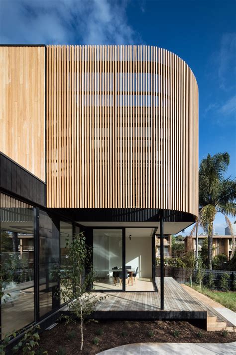 A curved timber screen adds design style and privacy to this Modscape extension. Sustainably ...