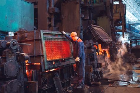 Premium Photo | Workers in the steel mill.