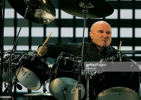 News Photo : Photo of Phil Collins behind the drums during... Charles ...